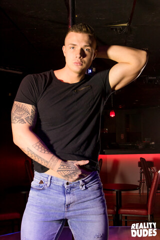 Handsome ripped Theo strips on a dancing pole and shows his big cock
