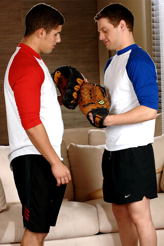 Baseball coach Andrew Blue kneels down and blows off pitcher Jimmy Clay