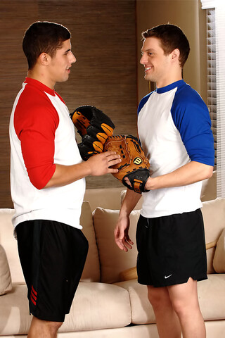 Baseball coach Andrew Blue kneels down and blows off pitcher Jimmy Clay